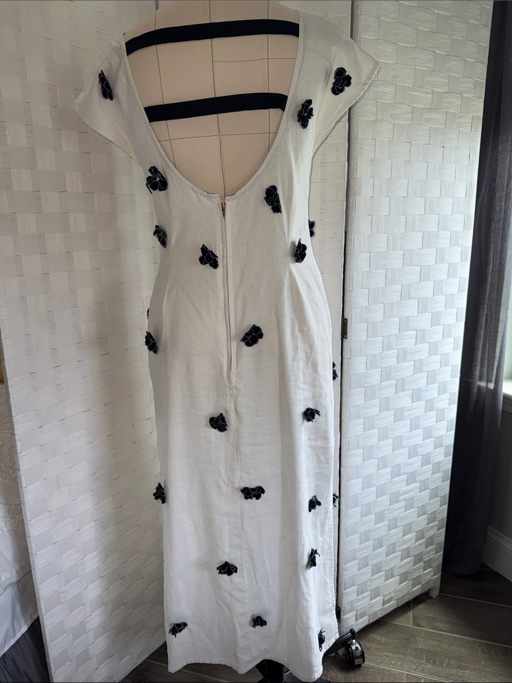 Elegant White Backless Maxi Dress with Black Floral Accents